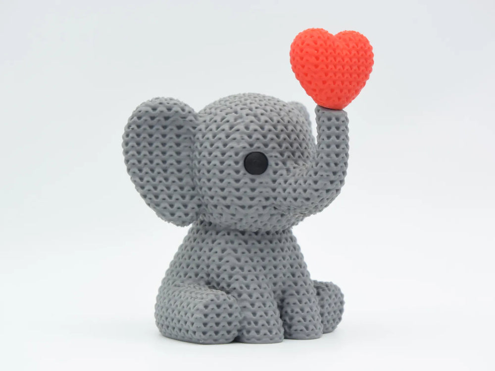 GESTRICKTER ELEFANT BLÄST HERZ – VALENTINSTAG