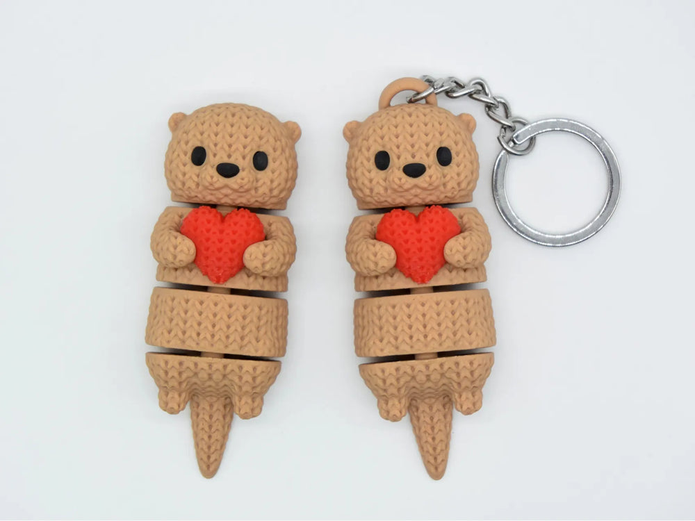 GESTRICKTER BEWEGLICHER OTTER MIT HERZ