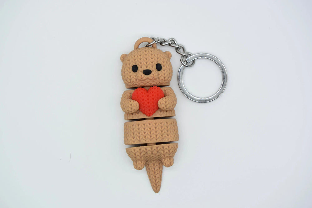 GESTRICKTER BEWEGLICHER OTTER MIT HERZ
