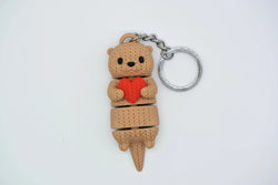 GESTRICKTER BEWEGLICHER OTTER MIT HERZ