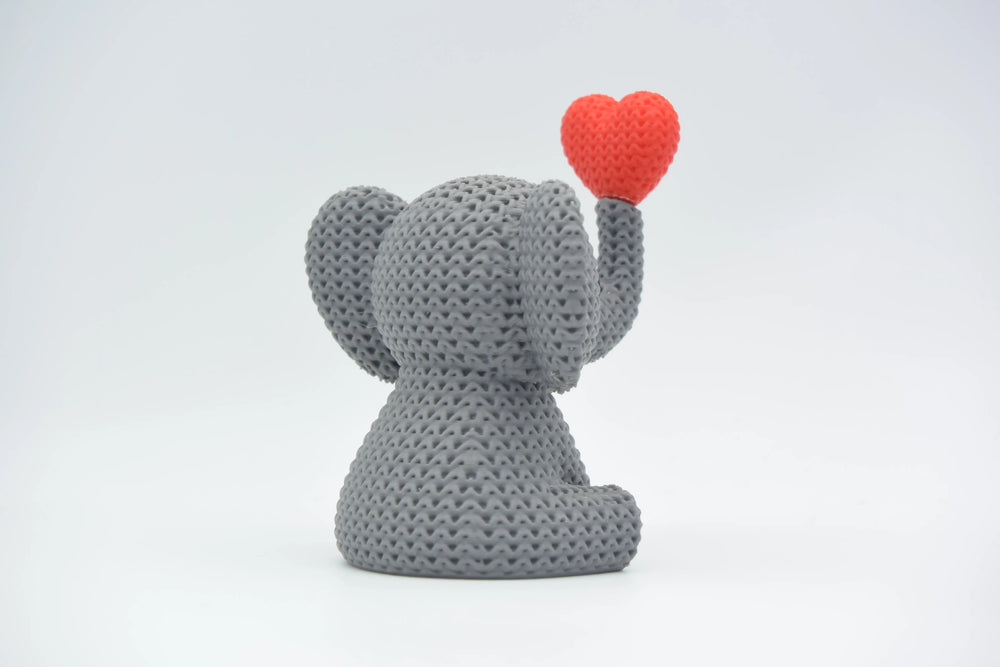 GESTRICKTER ELEFANT BLÄST HERZ – VALENTINSTAG