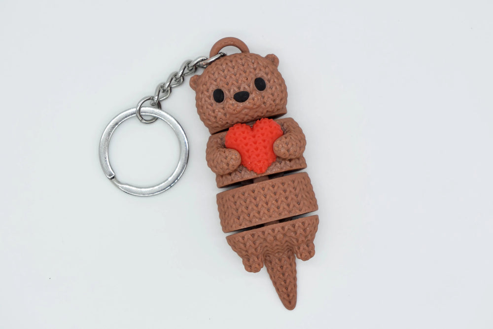 GESTRICKTER BEWEGLICHER OTTER MIT HERZ
