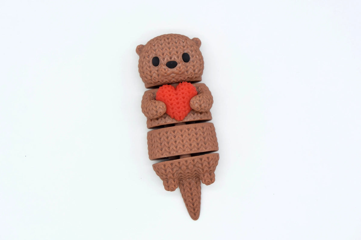 GESTRICKTER BEWEGLICHER OTTER MIT HERZ