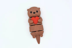 GESTRICKTER BEWEGLICHER OTTER MIT HERZ