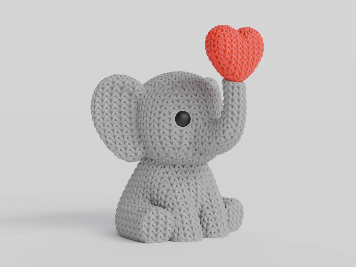 GESTRICKTER ELEFANT BLÄST HERZ – VALENTINSTAG