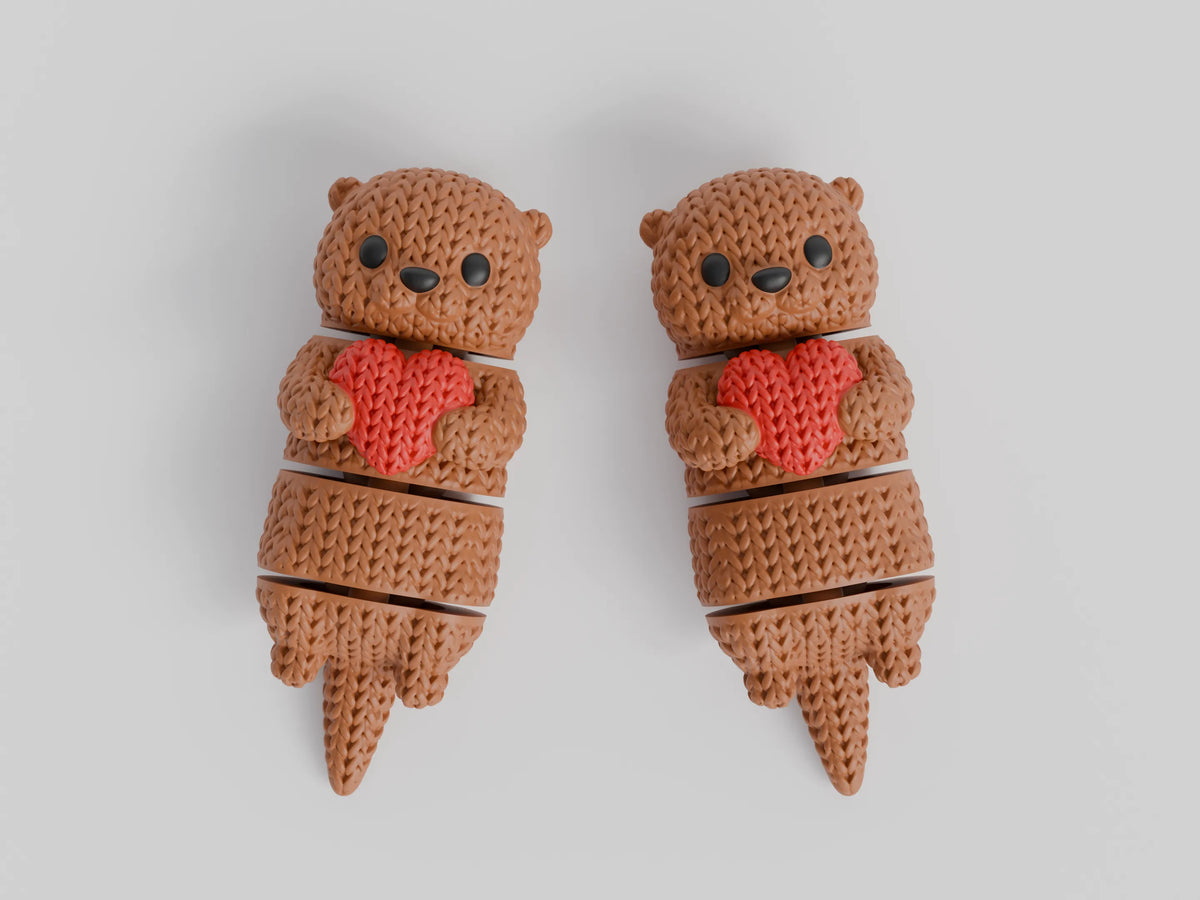 GESTRICKTER BEWEGLICHER OTTER MIT HERZ